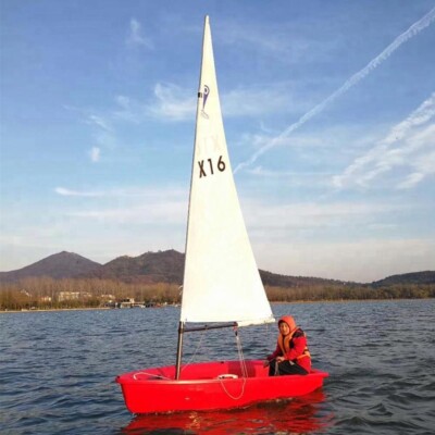 Small Optimist Student Sailboat with Outrigger